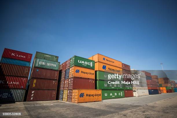 Containers are seen in the Duisburg port on July 16, 2018 in Duisburg, Germany. Approximately 25 trains a week use the "Silk Road" connection between...