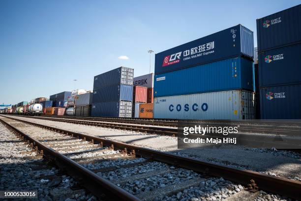 Containers from China are seen next to the train station in the Duisburg port on July 16, 2018 in Duisburg, Germany. Approximately 25 trains a week...