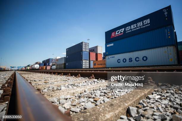 Containers from China are seen next to the train station in the Duisburg port on July 16, 2018 in Duisburg, Germany. Approximately 25 trains a week...