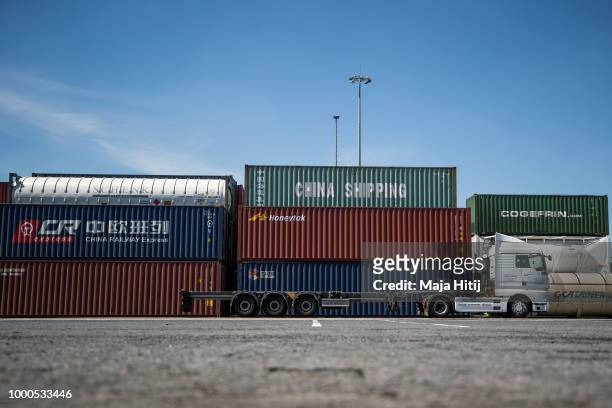 Containers from China are seen in the Duisburg port on July 16, 2018 in Duisburg, Germany. Approximately 25 trains a week use the "Silk Road"...