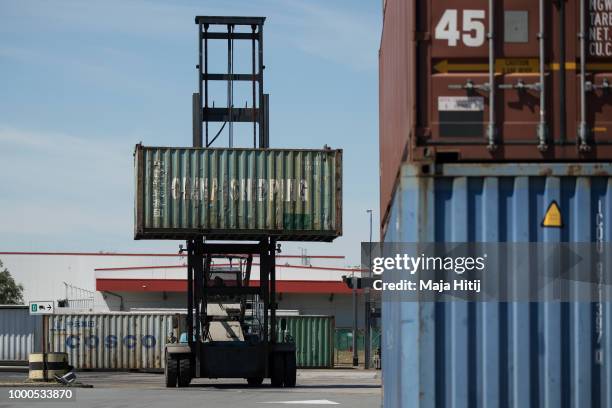 Container from China is carried at terminal in the Duisburg port on July 16, 2018 in Duisburg, Germany. Approximately 25 trains a week use the "Silk...