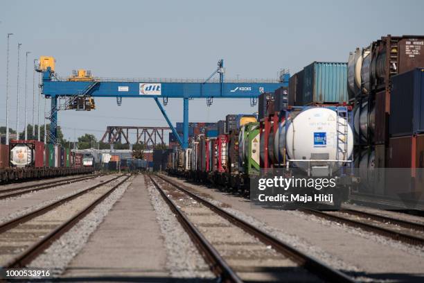 Containers are seen at train station in the Duisburg port on July 16, 2018 in Duisburg, Germany. Approximately 25 trains a week use the "Silk Road"...