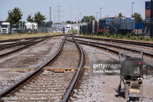 Containers are seen at train station in the Duisburg port on July 16, 2018 in Duisburg, Germany. Approximately 25 trains a week use the "Silk Road"...