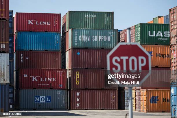 Containers are seen at terminal in the Duisburg port on July 16, 2018 in Duisburg, Germany. Approximately 25 trains a week use the "Silk Road"...