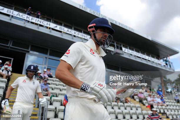Alastair Cook and Dawid Malan of England Lions walk out to bat during Day Two of the Tour Match match between England Lions and India A at New Road...