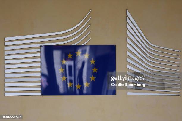European Union flag plaque sits on the Berlaymont building, which houses the headquarters of the European Commission, in Brussels, Belgium, on...