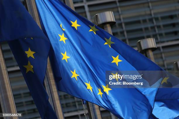 European Union flags fly outside the Berlaymont building, which houses the headquarters of the European Commission, in Brussels, Belgium, on Monday,...