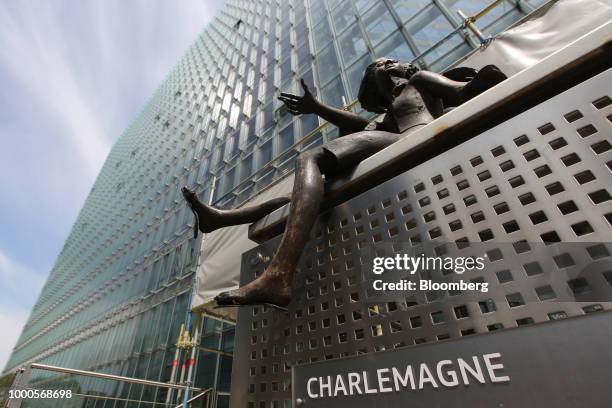 Bronze statue sits outside the Charlemagne building, which houses the Directorate-General for Economic and Financial Affairs, in Brussels, Belgium,...