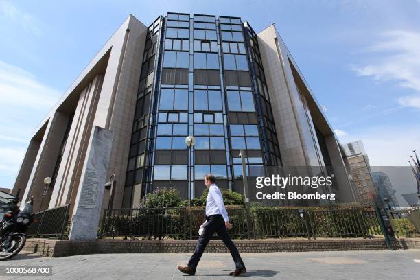 Pedestrian passes the Justus Lipsius building, which houses the headquarters of the European Union , in Brussels, Belgium, on Monday, July 17, 2018....
