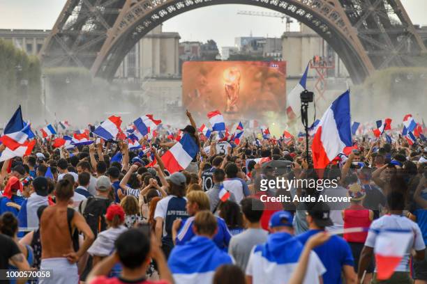 Fans watch the FIFA World Cup final match between France and Croatia at Fan Zone at Champ de Mars on July 15, 2018 in Paris, France.