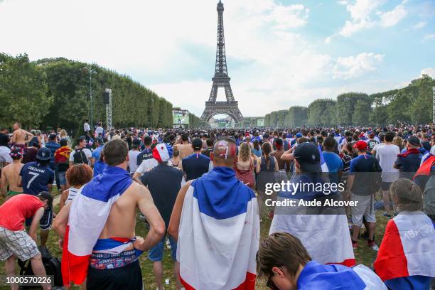 Fans watch the FIFA World Cup final match between France and Croatia at Fan Zone at Champ de Mars on July 15, 2018 in Paris, France.