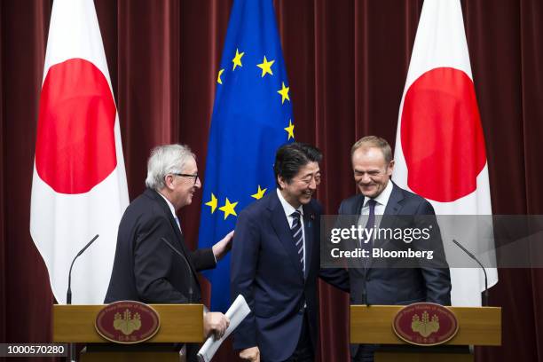 Shinzo Abe, Japan's prime minister, center, Jean-Claude Juncker, president of the European Commission, left, and Donald Tusk, president of the...