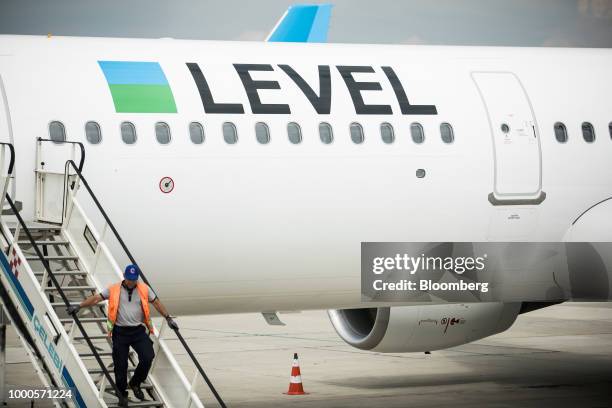 Passenger aircraft sit on the tarmac during an event to launch the Austrian base for low-cost brand Level, operated by International Consolidated...