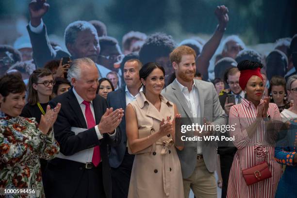 Lord Peter Hain, Chair of The Nelson Mandela Centenary Committee accompanies Prince Harry, Duke of Sussex, Meghan, Duchess of Sussex and Nelson...