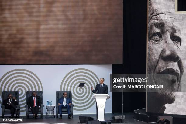 Former US President Barack Obama speaks next to the Chancellor of the University of Johannesburg, Professor Njabulo Ndebele , South African President...
