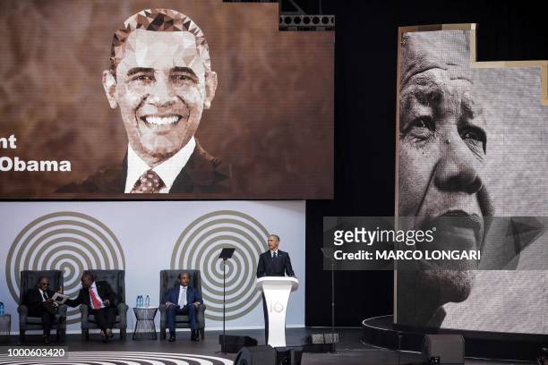 Former US President Barack Obama speaks next to the Chancellor of the University of Johannesburg, Professor Njabulo Ndebele , South African President...