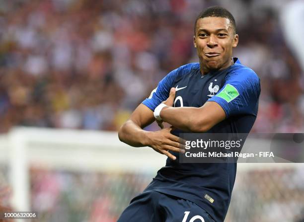 Kylian Mbappe of France celebrates with team mates after scoring his team's fourth goal during the 2018 FIFA World Cup Final between France and...