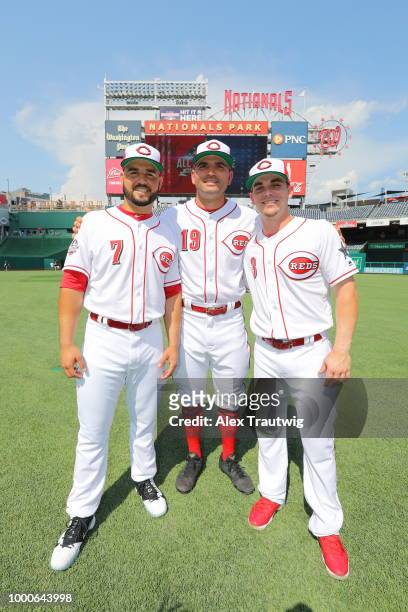 Yugenio Suarez, Joey Votto, and Scooter Gennett of the Cincinnati Reds pose for a photo during the Gatorade All-Star Workout Day at Nationals Park on...