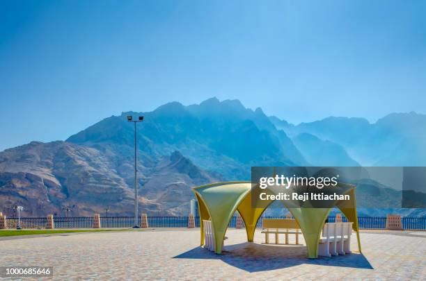 an ideal picnic spot with high mountains. - arabian tent stock-fotos und bilder