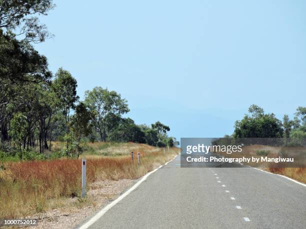 into the unknown - cairns road stock pictures, royalty-free photos & images