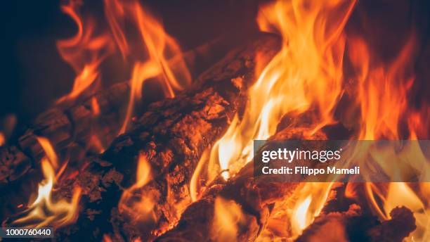 cozy mood - wood fire stock pictures, royalty-free photos & images