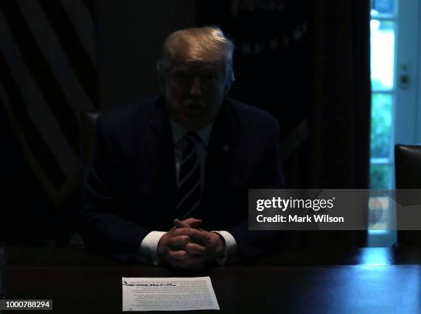 The lights temporarily go out in the Cabinet Room as U.S. President Donald Trump talks about his meeting with Russian President Vladimir Putin,...