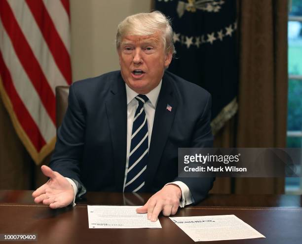 President Donald Trump talks about his meeting with Russian President Vladimir Putin, during a meeting with House Republicans in the Cabinet Room of...
