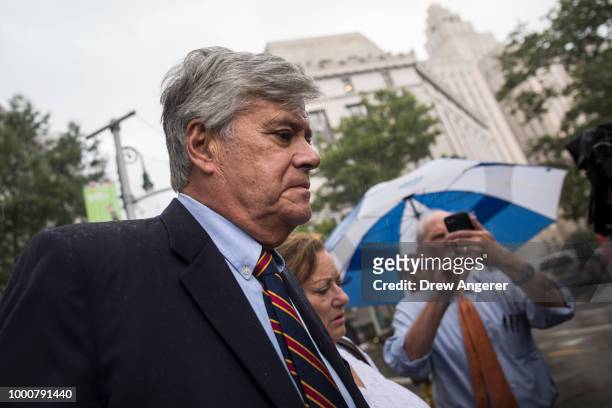 Dean Skelos, a former Republican politician and the former Majority Leader of the New York State Senate, and his wife Gail exit federal court, July...
