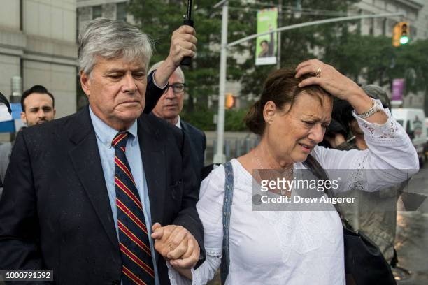 Dean Skelos, a former Republican politician and the former Majority Leader of the New York State Senate, and his wife Gail exit federal court, July...