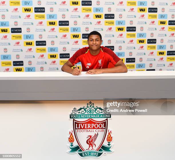 Rhian Brewster of Liverpool signing a contract extension on July 17, 2018 in Liverpool, England.
