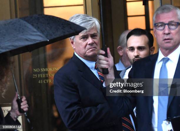 Former State Senate Majority Leader Dean Skelos, center, exits federal court in New York, U.S., on Tuesday, July 17, 2018. Skelos was found guilty of...