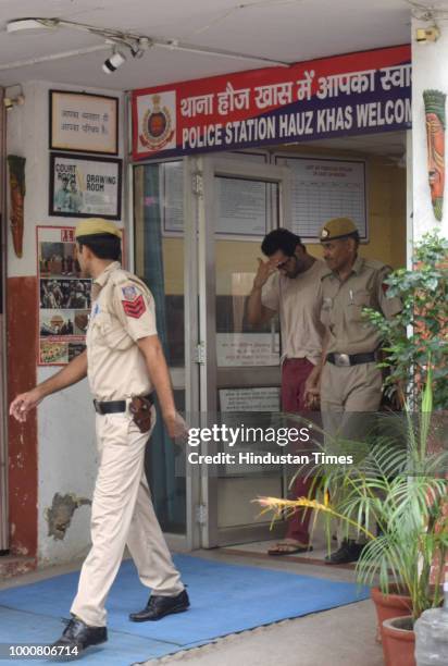 Mayank Singhvi husband of air hostess Anissia Batra is seen being taken to the court from the Hauz Khas police station in New Delhi, India on Tuesday...