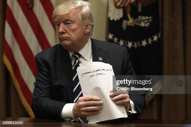 President Donald Trump holds his remarks for the media during a meeting with members of Congress in the Cabinet Room of the White House in...