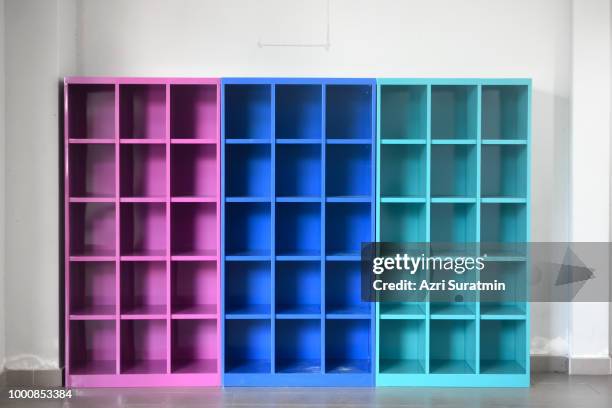 colorful wooden shelf - bookshelf foto e immagini stock