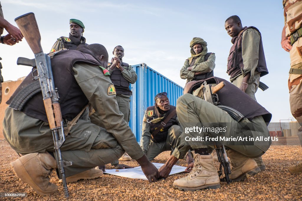 French soldiers from barkhane military operation in Mali (Africa) teaching malian soldiers how to fight against terrorism.