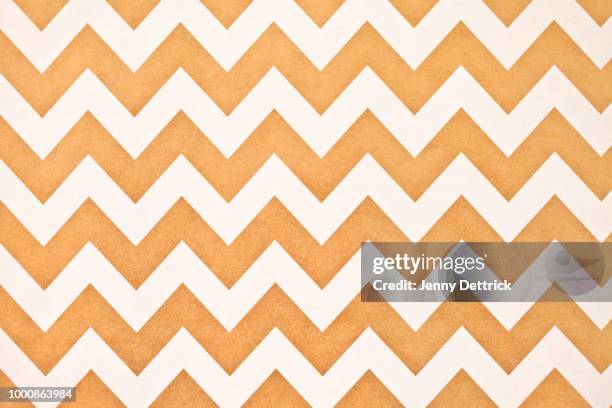 gold and white chevron pattern - zigzag fotografías e imágenes de stock