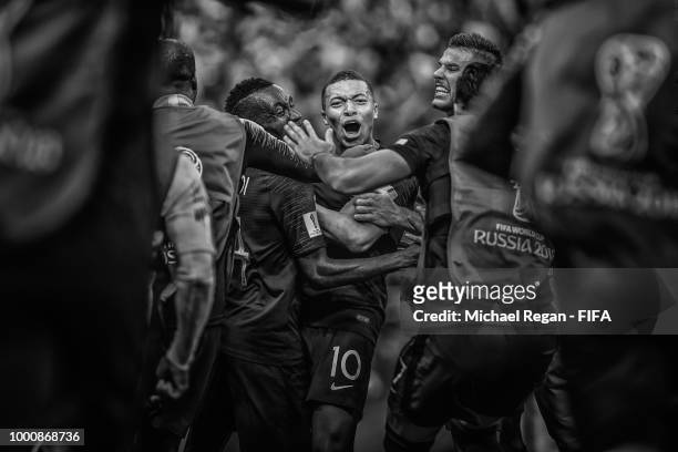 Kylian Mbappe of France celebrates with team mates after scoring his team's fourth goal during the 2018 FIFA World Cup Final between France and...