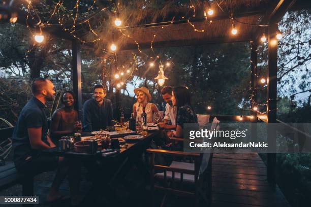 summer dinner party - evening meal stock pictures, royalty-free photos & images