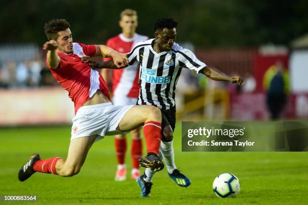 Christian Atsu of Newcastle United runs with the ball whilst being tackled by Lee Desmond of St.Patricks Athletic F.C. During the Pre Season Friendly...
