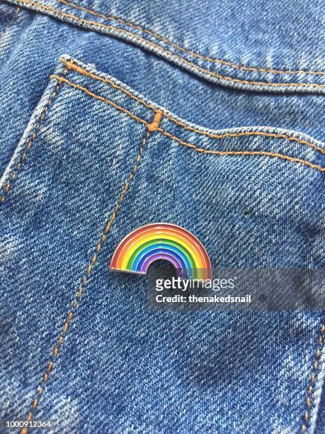 rainbow pin on denim jacket - denim jacket badges stock pictures, royalty-free photos & images