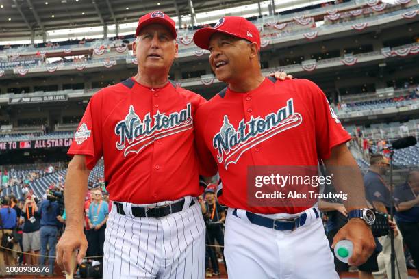 Bud Black of the San Diego Padres and Dave Roberts of the Los Angeles Dodgers joke around during batting practice prior to the 89th MLB All-Star Game...