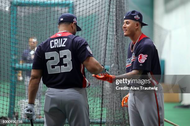 Nelson Cruz of the Seattle Mariners and Manny Machado of the Baltimore Orioles talk in the batting cage prior to the 89th MLB All-Star Game at...