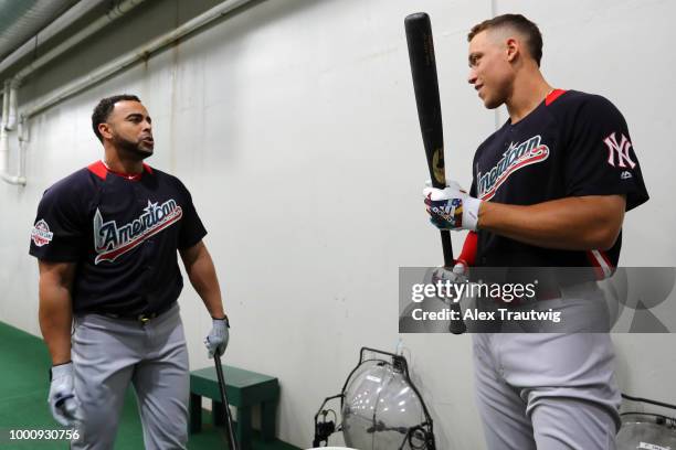 Aaron Judge of the New York Yankees and Nelson Cruz of the Seattle Mariners talk in the batting cage prior to the 89th MLB All-Star Game at Nationals...