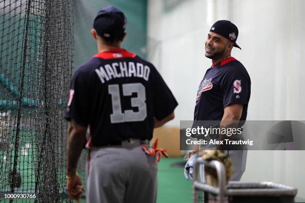Nelson Cruz of the Seattle Mariners and Manny Machado of the Baltimore Orioles talk in the batting cage prior to the 89th MLB All-Star Game at...