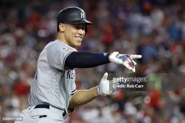 Aaron Judge of the New York Yankees and the American League celebrates after hitting a solo home run in the second inning against the National League...