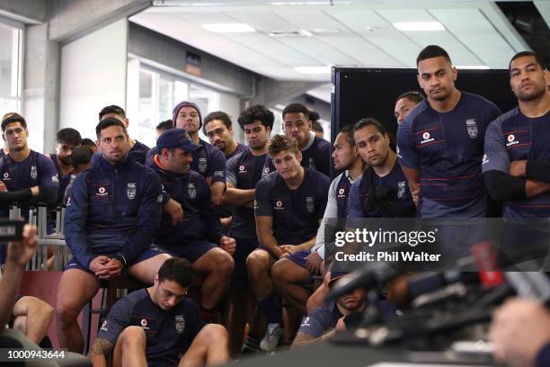 Warriors players look on as Simon Mannering holds a press conference to announce his retirement at Mt Smart Stadium on July 18, 2018 in Auckland, New...