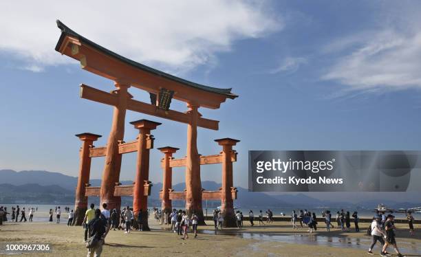 Photo taken on July 15 shows the gate of Itsukushima Shrine, a UNESCO World Heritage site in Hatsukaichi, Hiroshima Prefecture, western Japan. ==Kyodo
