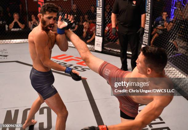 Vince Morales kicks Domingo Pilarte in their bantamweight fight during Dana White's Tuesday Night Contender Series at the TUF Gym on July 17, 2018 in...