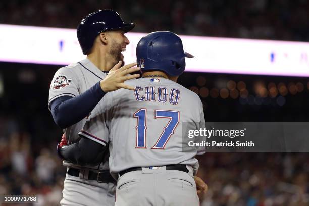 George Springer of the Houston Astros and the American League and Shin-Soo Choo of the Texas Rangers and the American League celebrate after scoring...