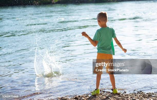 Child Throwing Rocks Throws Stone Photos and Premium High Res Pictures - Getty Images